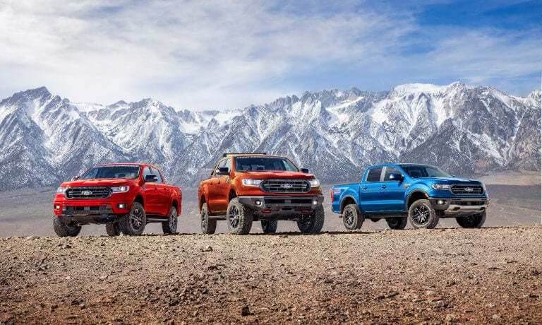 Three 2023 Ford Rangers exterior parked by mountains