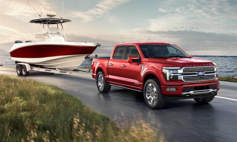 2024 Ford F150 Exterior Towing A Boat By Lake